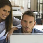 Business people in office using computer